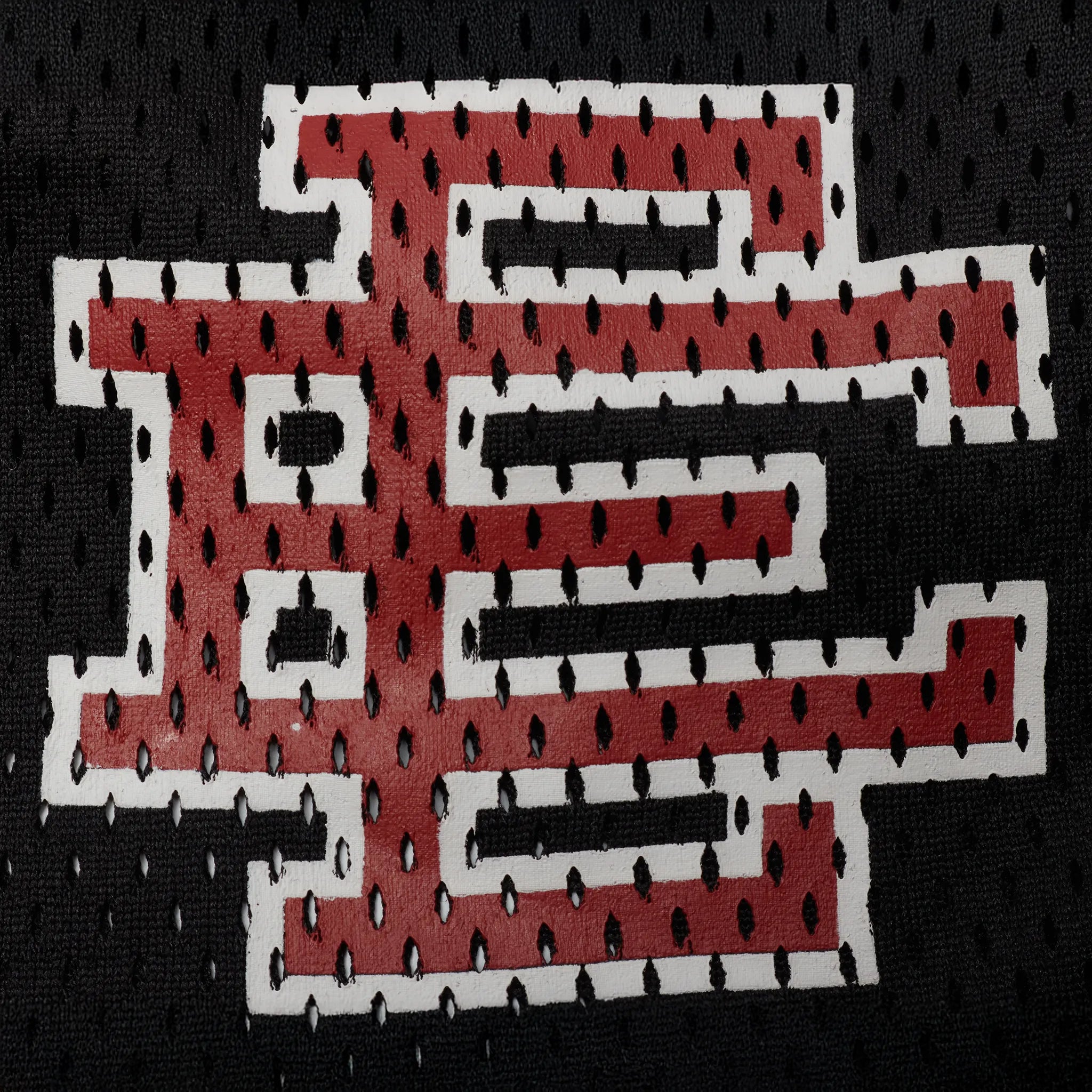 Detailed Logo View of Eric Emanuel EE Basic Lighting Bolt Black Yellow Red Short